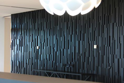 A dramatic backdrop created with Stack Panel feature panelling in Black Japan Stained Cedar.