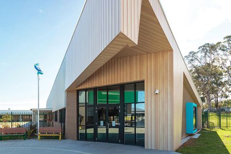 DecoClad® Shadowline cladding in DecoWood® Curly Birch finish wraps the state-of-the-art Hunter Sports High School.